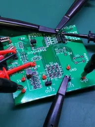 Close-up of a pulse generator test board covered with oscilloscope probes during bring-up Close-up of a pulse generator test board covered with oscilloscope probes during bring-up