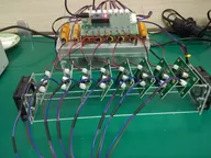 Prototype rig with multiple small boards mounted in an acrylic frame and connected to a shared controller Prototype rig with multiple small boards mounted in an acrylic frame and connected to a shared controller