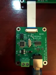 Main board connected by a flat-flex cable to a separate single reader board Main board connected by a flat-flex cable to a separate single reader board