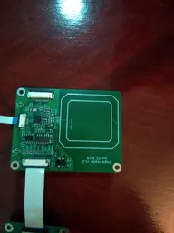 Single reader board connected by ribbon cable, showing the square printed sensing coil Single reader board connected by ribbon cable, showing the square printed sensing coil