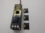 Assembled DI-Lambda spectrophotometer with interchangeable sensor modules laid out beside it Assembled DI-Lambda spectrophotometer with interchangeable sensor modules laid out beside it